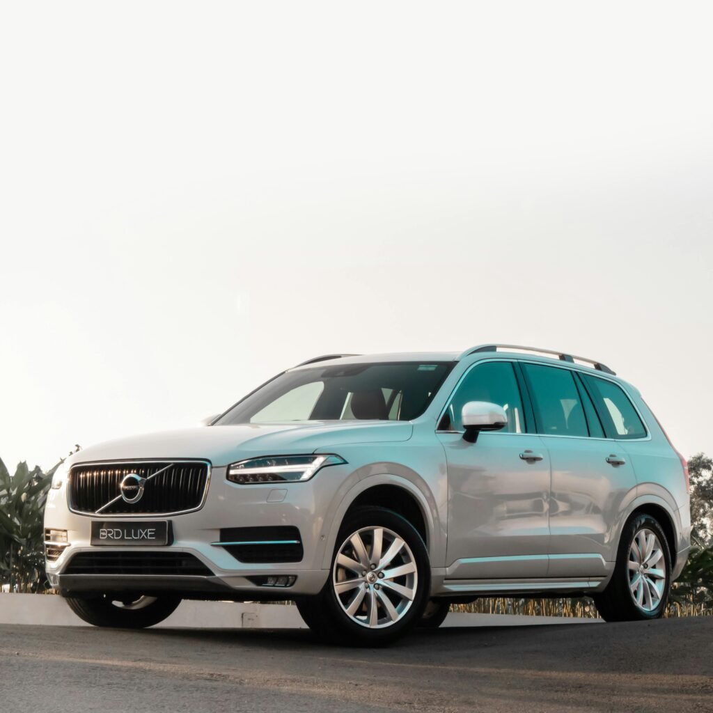 Elegant white SUV on a clear day, showcasing luxury and style.